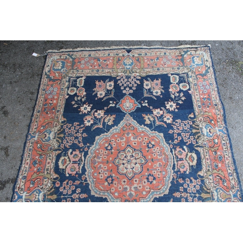 5 - Tabriz rug with a medallion and all-over floral design on a midnight blue ground with vase design bo... 