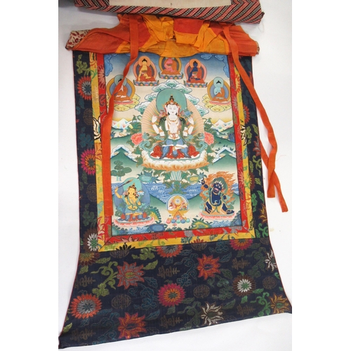 50 - Two modern hand painted Tibetan Thangkas with textile borders, the largest 65 x 45cm excluding the b... 