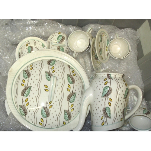 500 - Susie Cooper floral decorated part dinner service, together with another similarly decorated dinner ... 