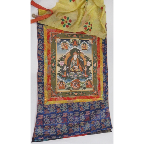 51 - Group of three modern hand painted Tibetan Thangkas with textile borders, the largest 60 x 45cm appr... 