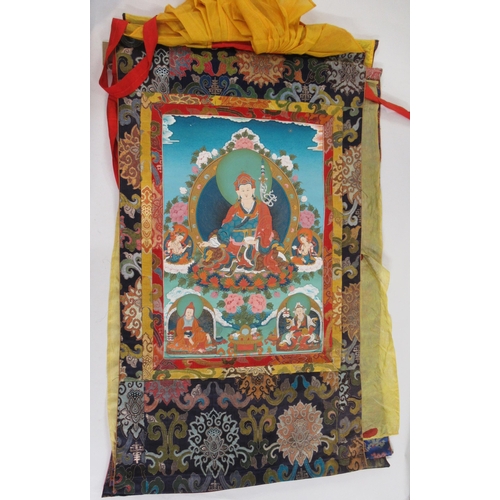 51 - Group of three modern hand painted Tibetan Thangkas with textile borders, the largest 60 x 45cm appr... 