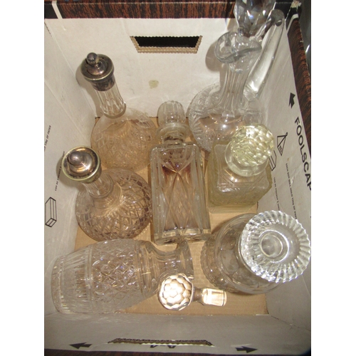 524 - Pair of cut glass conical decanters with plated stoppers and five other various cut glass decanters