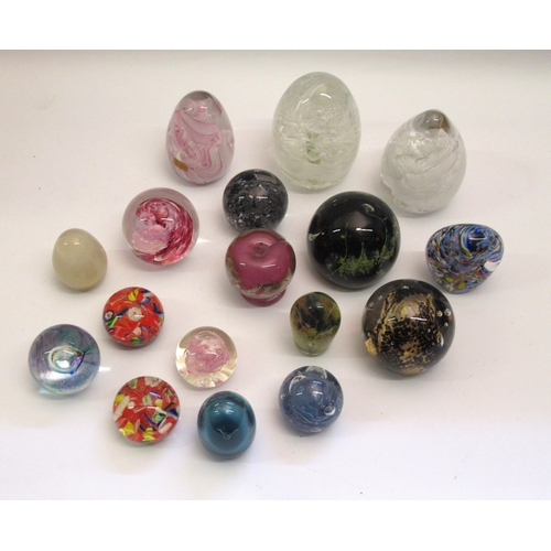 553 - Box containing a collection of various glass paperweights