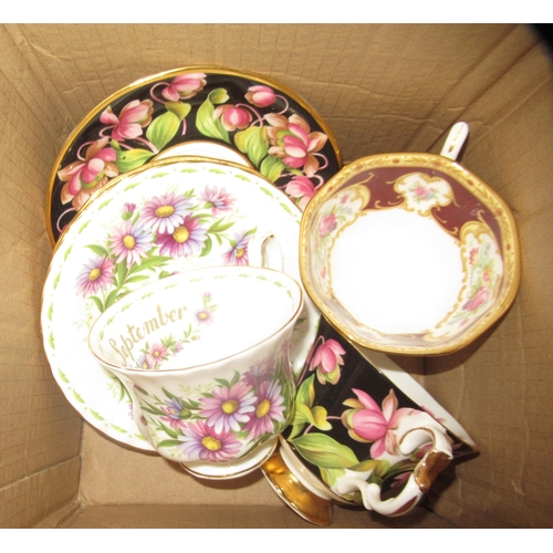 556 - Aynsley set of coffee cans and saucers, together with another part floral decorated teaset