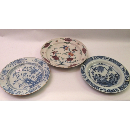 646 - Two antique blue and white delftware plates, 30cm diameter, together with a polychrome delftware pla... 