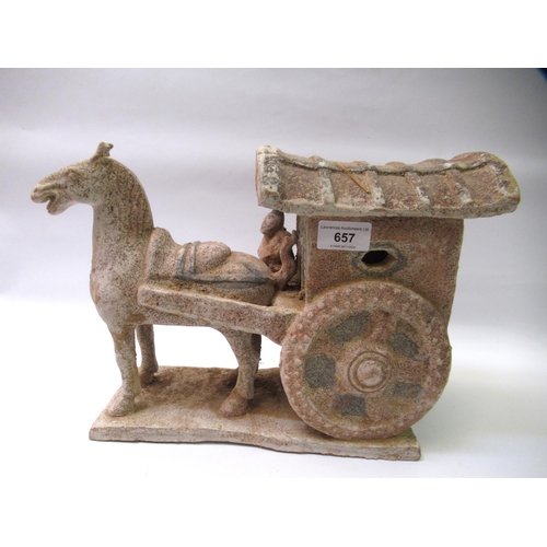 657 - Tang style pottery group of a figure driving a horse and cart, 37cm long