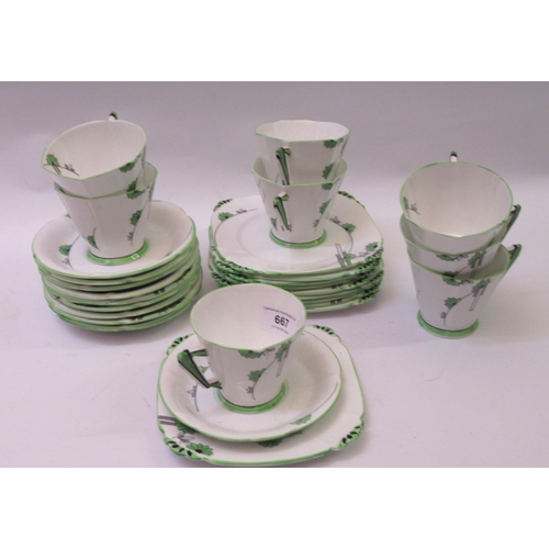 667 - Alfred Pearce Art Deco eight place tea service of geometric and floral design