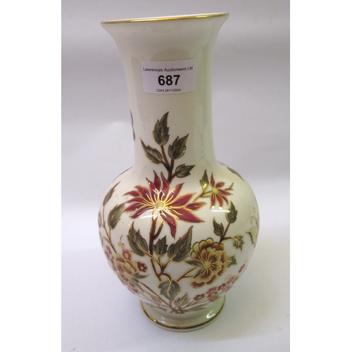 687 - Modern Zsolnay floral decorated vase, 26cm high, together with a Szecsi terracotta group of two chil... 