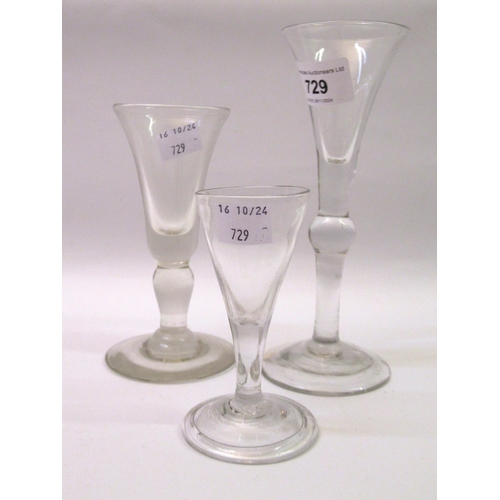 729 - Group of three plain fluted wine glasses, two with baluster stems, the tallest 17.5cm high