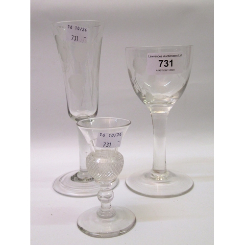 731 - Two wine glasses with floral etched bowls, the tallest 18cm high, together with a later thistle liqu... 