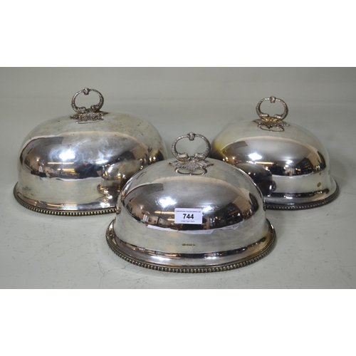 744 - Graduated set of three oval silver plated meat dish covers