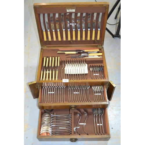 752 - Silver plated twelve place setting canteen of Old English pattern cutlery in an oak cabinet (incompl... 