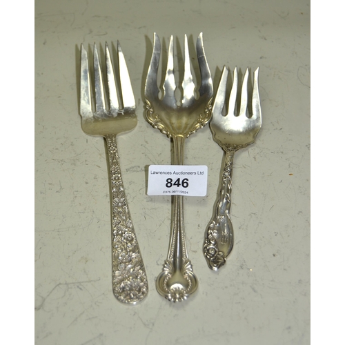 846 - Three sterling silver serving forks of various designs, including floral