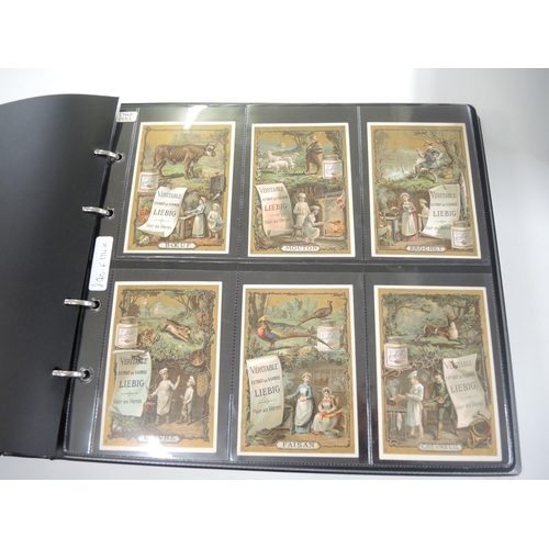 87 - Album containing thirty one sets of Liebig collectors cards