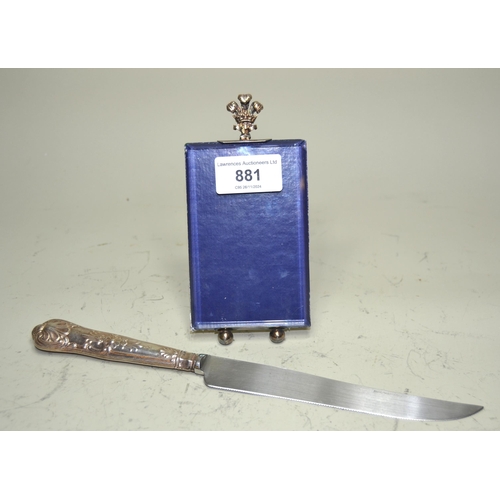 881 - Silver handled Queens pattern cake knife and a silver plated and glass photo frame with Prince of Wa... 