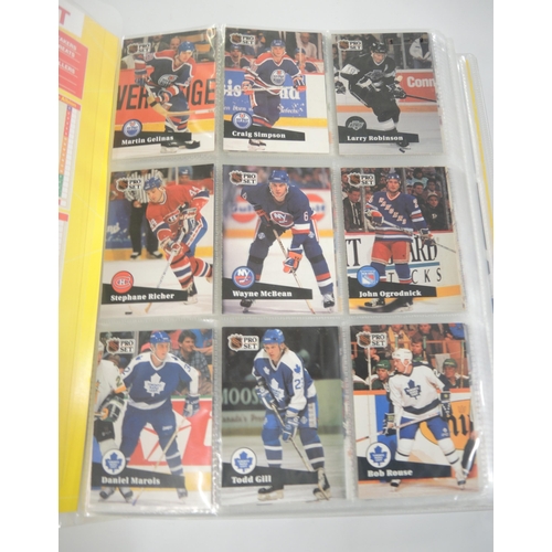 90 - Two albums containing Pro Set hockey, racing, together with another album containing Bowman 1991 Ame... 