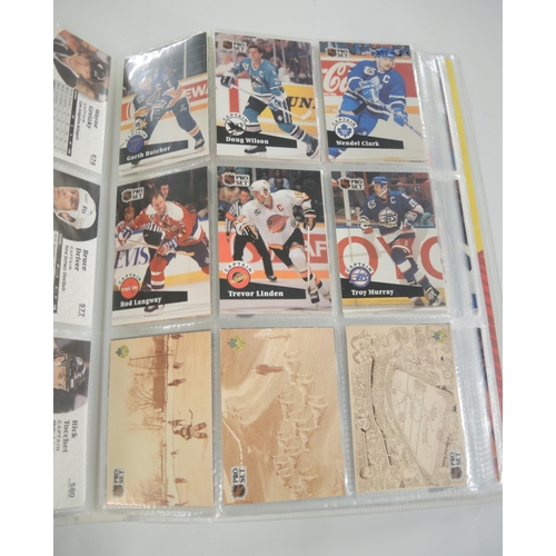 90 - Two albums containing Pro Set hockey, racing, together with another album containing Bowman 1991 Ame... 