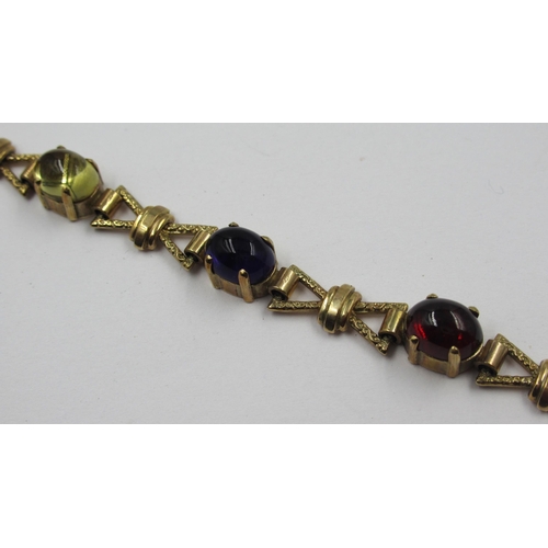 909 - 9ct Gold bracelet set semi-precious stones, 15.1g