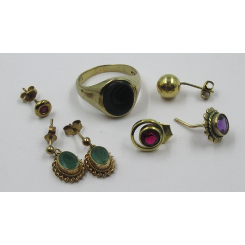 985 - Pair of 9ct gold earrings set with emeralds, four single earrings and a gentleman's signet ring set ... 