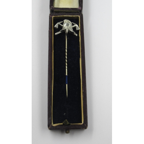 988 - Silver stick pin mounted with a fireman's helmet and two axes