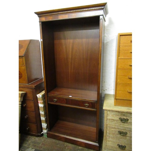 2005 - Good quality reproduction mahogany open bookcase, the moulded cornice above adjustable shelves and s... 