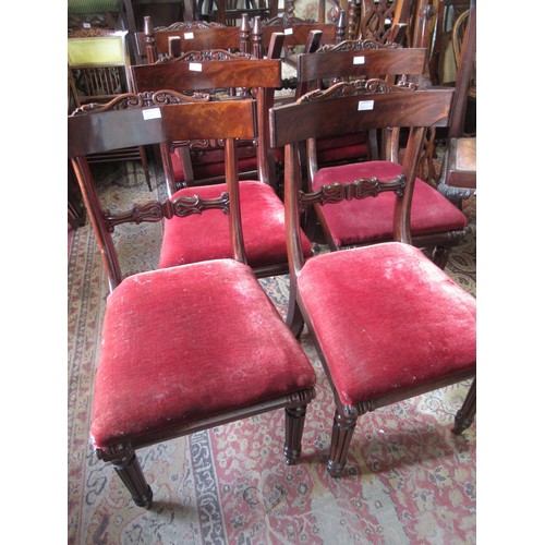 2012A - Set of eight George IV mahogany dining chairs, the carved rail backs above drop-in seats and turned ... 