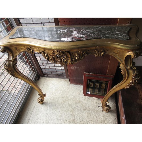 2034 - Early 20th Century carved and gilded console table, the shaped marble inset top above a pierced frie... 