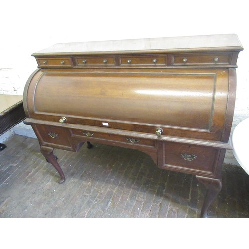 1752B - Early 20th Century oak roll top desk, the cylinder action top with a four drawer surmount enclosing ... 