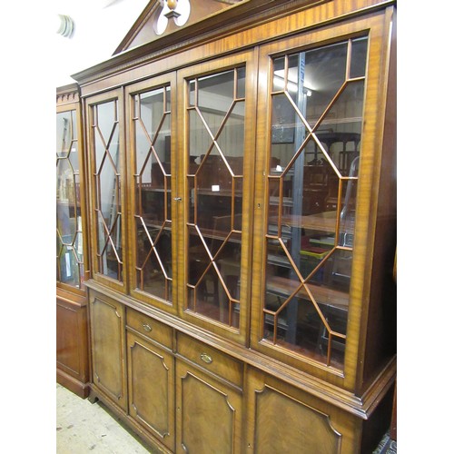 2030A - Reproduction four door bookcase with broken arch pediment above astragal glazed doors, drawers and p... 