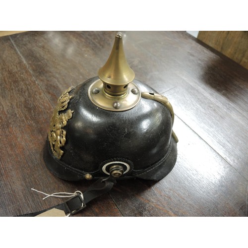 220 - Early 20th Century Bavarian pickelhaube, leather bound with brass fittings and leather liner