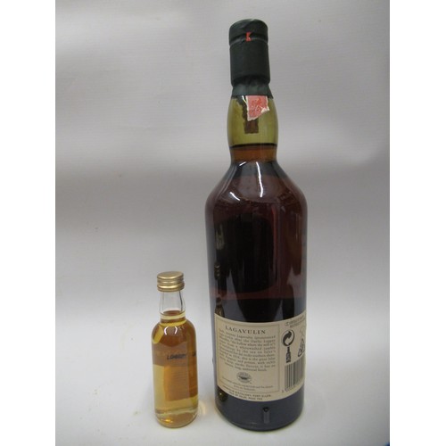 1569 - One bottle, Lagavulin single Islay malt whisky, 16 years aged, boxed, together with a miniature bott... 