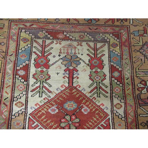 7 - Melas prayer rug with a small central Mihrab within a wide multiple border in typical pastel shades,... 