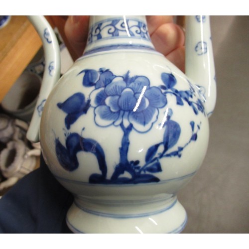 513 - Chinese blue and white teapot with cover, 25cm high, together with a stoneware rose water bottle in ... 