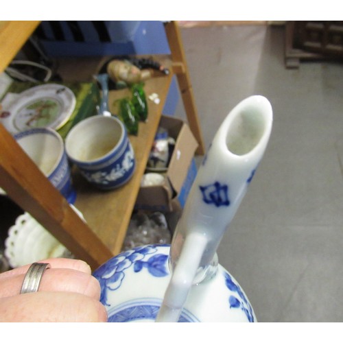 513 - Chinese blue and white teapot with cover, 25cm high, together with a stoneware rose water bottle in ... 