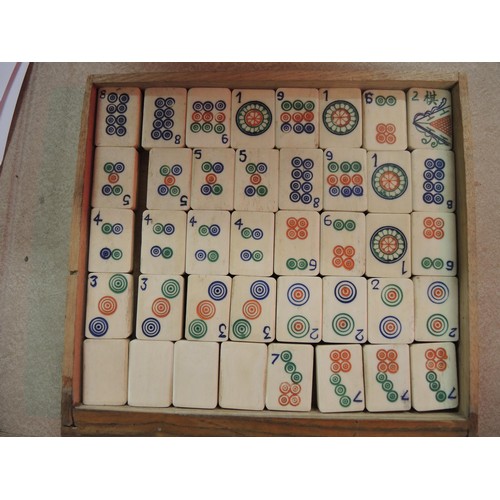 225 - Early 20th Century oak cased mahjong set, the case with silver plated mounts, the sliding door enclo... 