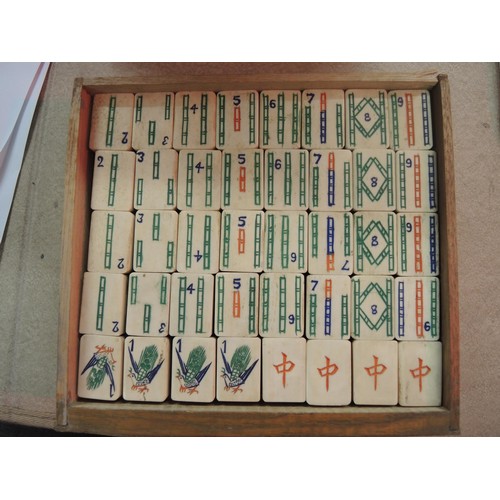 225 - Early 20th Century oak cased mahjong set, the case with silver plated mounts, the sliding door enclo... 