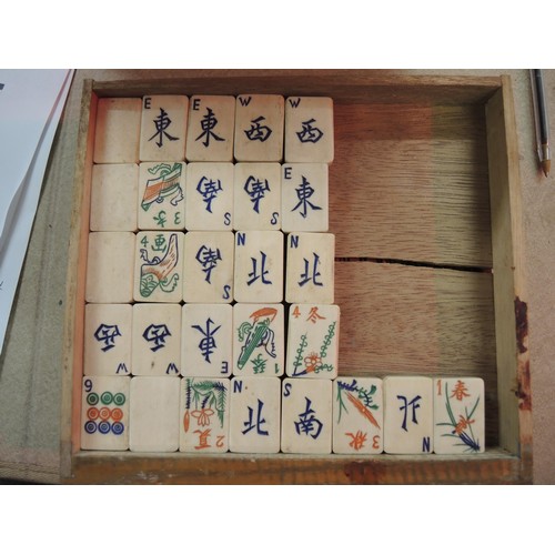 225 - Early 20th Century oak cased mahjong set, the case with silver plated mounts, the sliding door enclo... 