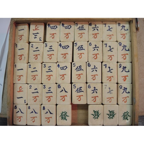 225 - Early 20th Century oak cased mahjong set, the case with silver plated mounts, the sliding door enclo... 