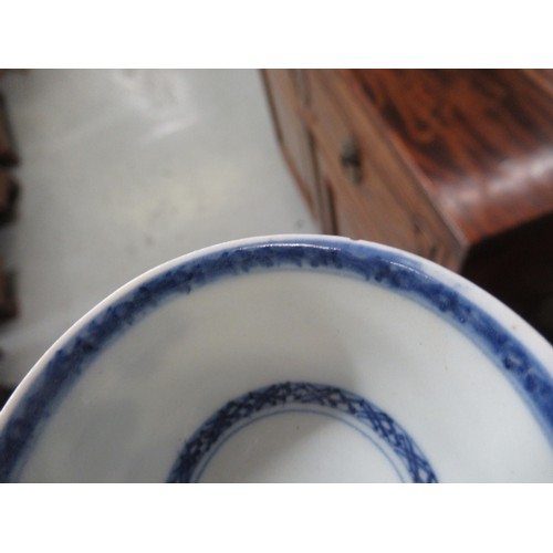 605 - Nanking Cargo blue and white tea bowl and saucer, the saucer 10cm diameter on a hardwood stand