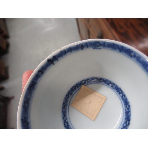 605 - Nanking Cargo blue and white tea bowl and saucer, the saucer 10cm diameter on a hardwood stand