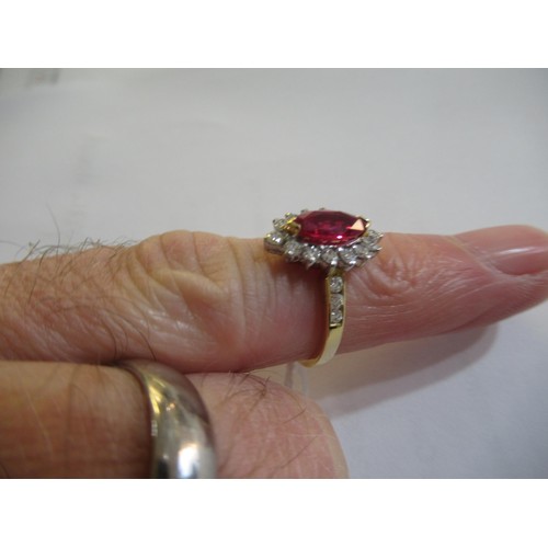 957 - 18ct Yellow gold ruby and diamond cluster ring, size K, 3.7g