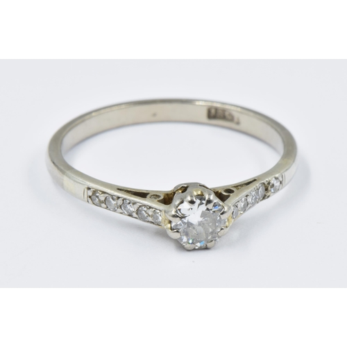 1027 - 18ct White gold diamond solitaire ring with diamond set shoulders, size N, 2.3g