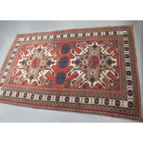 13 - Turkish rug of Kazak design, with all-over geometric floral design, multiple borders, 267 x 170cm