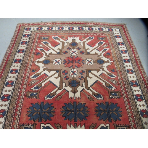 13 - Turkish rug of Kazak design, with all-over geometric floral design, multiple borders, 267 x 170cm