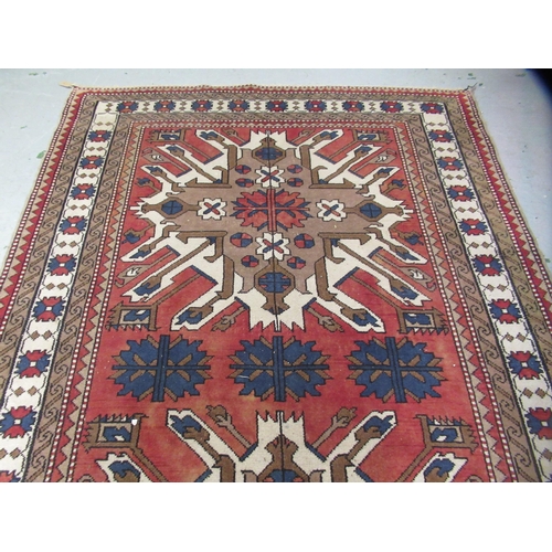 13 - Turkish rug of Kazak design, with all-over geometric floral design, multiple borders, 267 x 170cm