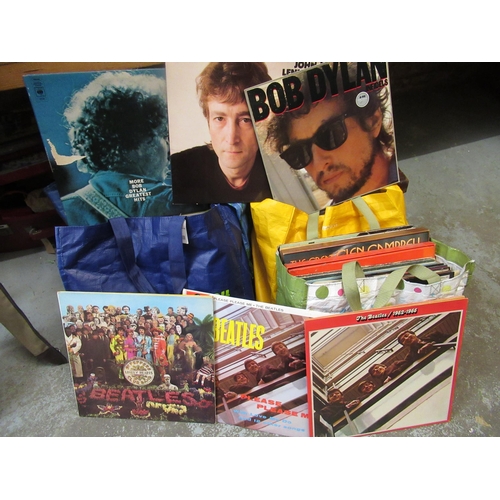 153 - Four bags containing a large collection of 20th Century LP's, including The Beatles and other variou... 