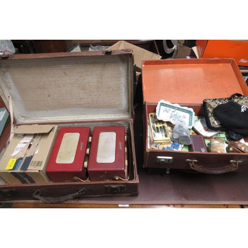 154 - Three suitcases containing a quantity of miscellaneous items, including two clutch bags, enamel dish... 