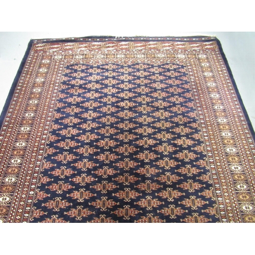 16 - Pakistan Bokhara rug of Turkoman design with multiple gols on a midnight blue ground with borders, 2... 