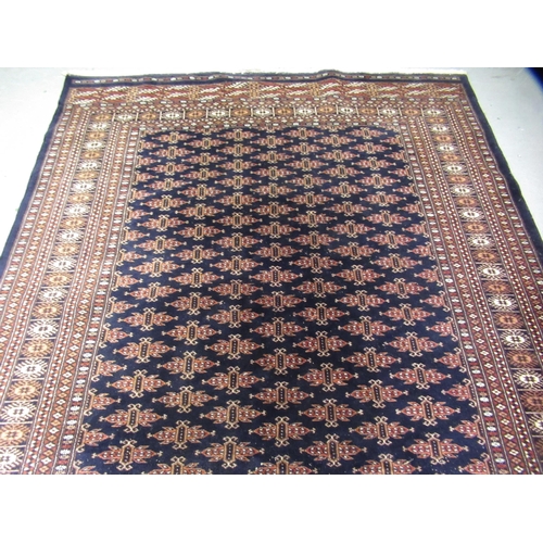 16 - Pakistan Bokhara rug of Turkoman design with multiple gols on a midnight blue ground with borders, 2... 