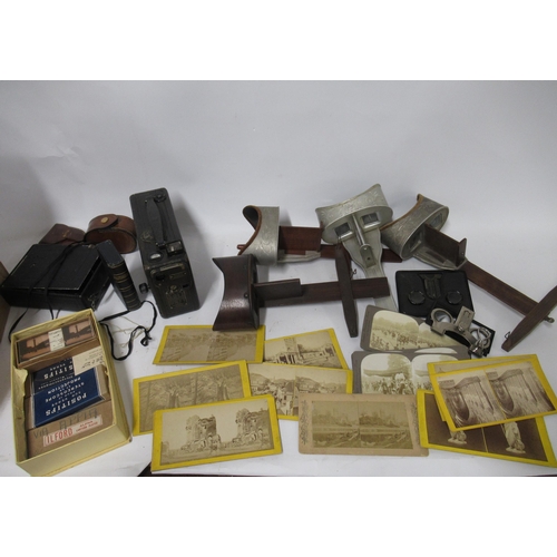 185 - Group of four hand-held stereo viewers, small collection of cards, bellows camera, cine camera and s... 